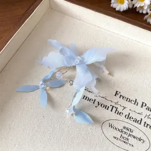 Elegant light blue fabric flower and butterfly hair clip with shimmering crystal beads