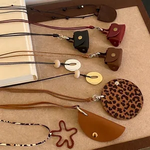 Variety of faux leather geometric pendant necklaces including leopard print styles