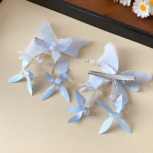 Blue fabric butterfly hair clip detail with crystal beads and metal duckbill clip back