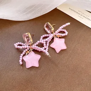 Pink pearl bow earrings with resin stars and sparkling crystal studs for women