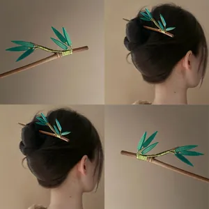 Detailed views and model presentation of an elegant bamboo-style hair stick accessory.