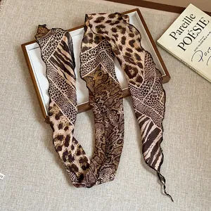 Detail shot of animal print neck scarf necklace with leopard and snake patterns