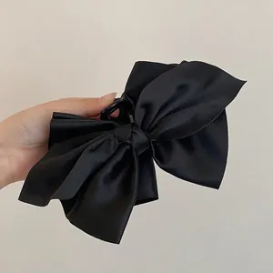 Grande molletta per capelli con fiocco in raso nero per uno stile francese elegante