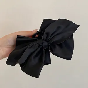 Elegante molletta per capelli grande con fiocco in raso nero per uno stile francese chic