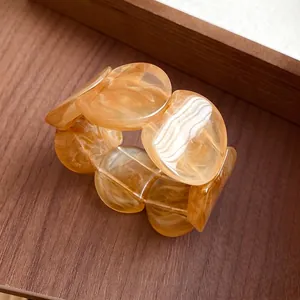 Amber marbled acrylic round bead bracelet with an elegant Korean style for women.
