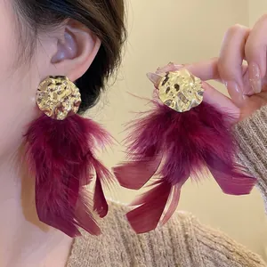 Statement luxury burgundy feather tassel earrings with gold crumpled metal studs for women