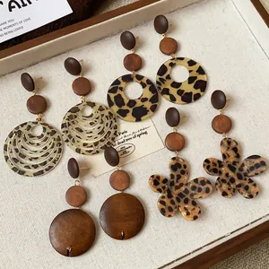Detail of vintage Maillard style leopard print and wooden flower dangle earrings