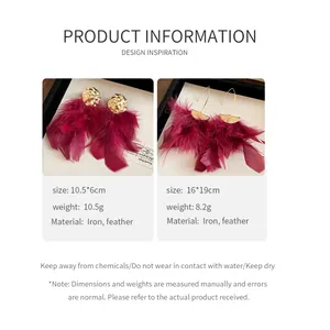 Detailed view of burgundy feather earrings with gold textured metal accents and sizes.