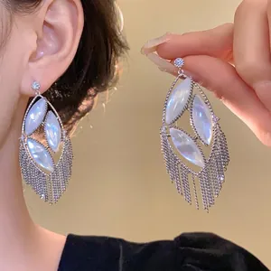 Elegant silver needle earrings with zircon and pearlescent oval stones and chain tassels