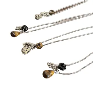 Vintage teardrop pendant necklace featuring tiger eye and dalmatian jasper stone beads
