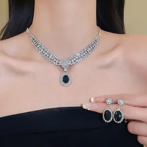 Luxury bridal jewelry set with oval black zircon necklace and matching earrings.