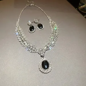 Luxury bridal zircon jewelry set detail featuring black oval stones and sparkly crystals