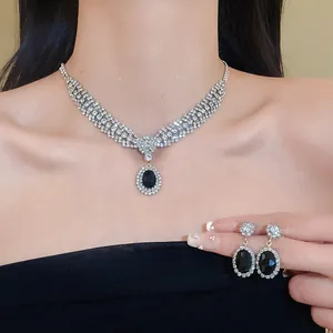 Elegant bridal jewelry set featuring black oval stone necklace and matching earrings