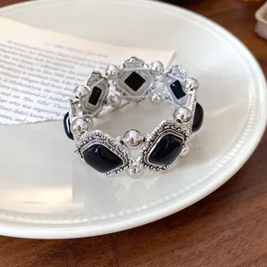 Close-up of vintage palace style elastic bracelet with black diamond acrylic stones