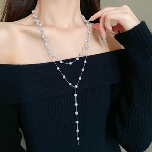 Detailed view of an elegant double-layered artificial pearl long necklace for women