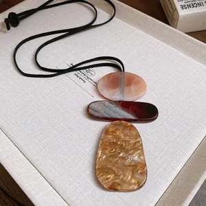 Retro marbled resin geometric pendant necklace with a black leather cord for women