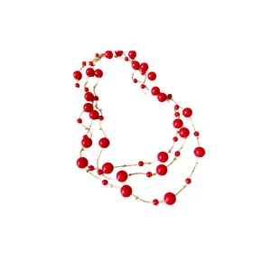 Elegant vintage red faux pearl long sweater necklace featuring delicate gold wire links