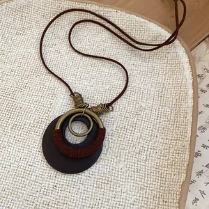 Vintage boho style wooden circle pendant necklace with rustic bronze rings