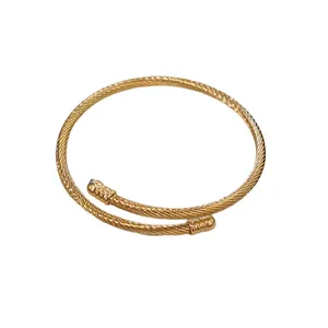 Minimalist gold twisted cable cuff bracelet with elegant bypass design for women