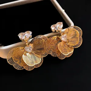 Elegant gold plated flower earrings with heart-shaped zirconia stones