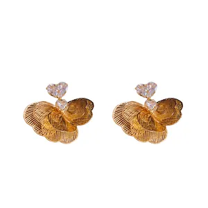 Elegant gold-plated flower stud earrings featuring sparkling heart-shaped zircon accents.