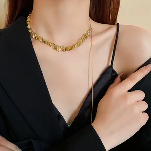 Close-up of elegant gold wheat sequin tassel necklace on model, minimalist fashion style