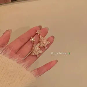Sparkling rose gold Christmas tree stud earrings with star topper and clear stones jewelry