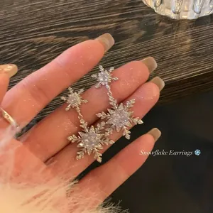 Elegant silver snowflake drop earrings with sparkling cubic zirconia for Christmas