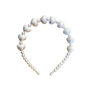 Elegant vintage white pearl headband featuring iridescent heart beads for women's hair
