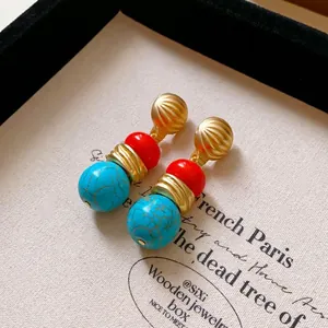 Vintage palace style dangle earrings with turquoise and red beads in gold finish