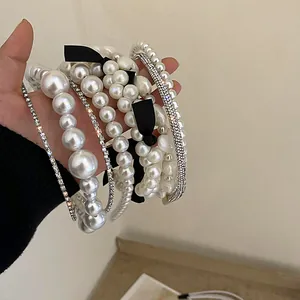 Selection of retro French style headbands with white pearls and sparkling rhinestones