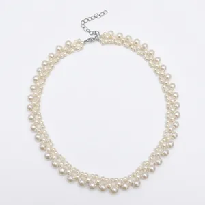 Elegant French vintage pearl necklace with a layered design and adjustable silver-tone chain.