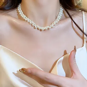 Detailed view of an elegant French vintage multi-layer pearl choker necklace for women