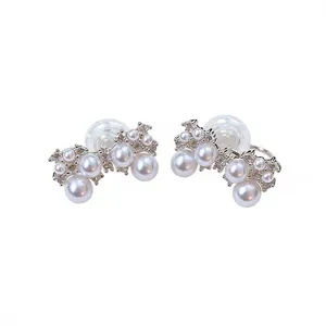 Elegant French style bow-knot clip-on earrings featuring lustrous pearls and sparkling zircons