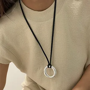 Minimalist silver ring pendant necklace on black adjustable cord for elegant styling