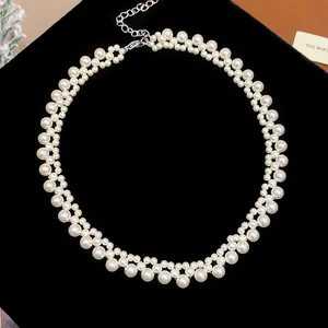 Detail view of French retro double-strand pearl necklace on elegant black velvet background