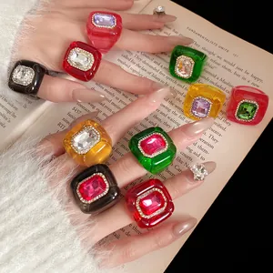 Retro resin rings with rhinestones and textured hexagonal design in various colors.