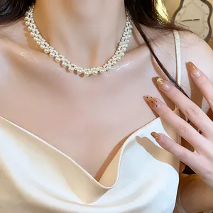 Detailed close-up shot of an elegant French retro layered pearl necklace on model