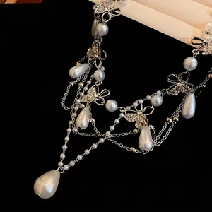 Elegant French style layered butterfly pearl necklace featuring sparkling rhinestones and teardrop pearls