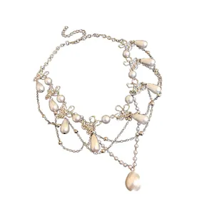 Elegant multi-layer pearl necklace with rhinestone butterfly charms for women.
