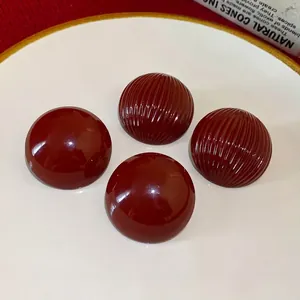 Vintage burgundy round stud earrings with smooth and ribbed striped design.