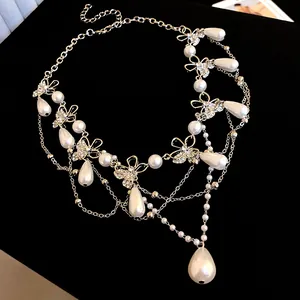 Detailed view of elegant butterfly pearl necklace with sparkling rhinestones