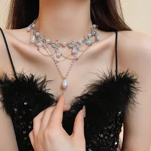 Detailed close-up of an elegant butterfly pearl necklace with sparkling diamond accents