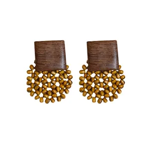 Retro bohemian style geometric wood stud earrings with circular beadwork design