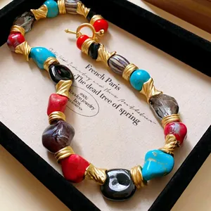 Vintage colorful chunky bead necklace with gold textured spacers presented in a gift box