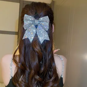Elegant oversized rhinestone bow hair clip with sparkling crystals for bridal hairstyles