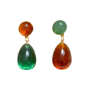 Asymmetrical resin water drop earrings in retro orange and green translucent finish