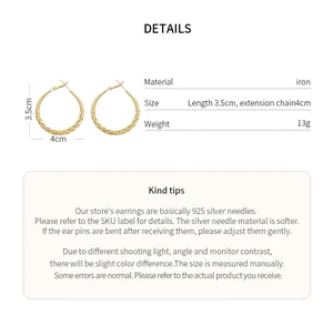 Detailed view of gold braided hoop earrings with size and material specifications