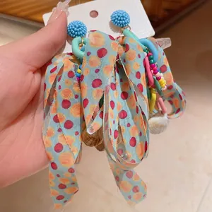 Bohemian fabric bow earrings with colorful beads and shell charms for summer vacations