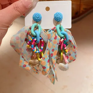 Colorful bohemian bow earrings with rice beads and shell charms for women holiday